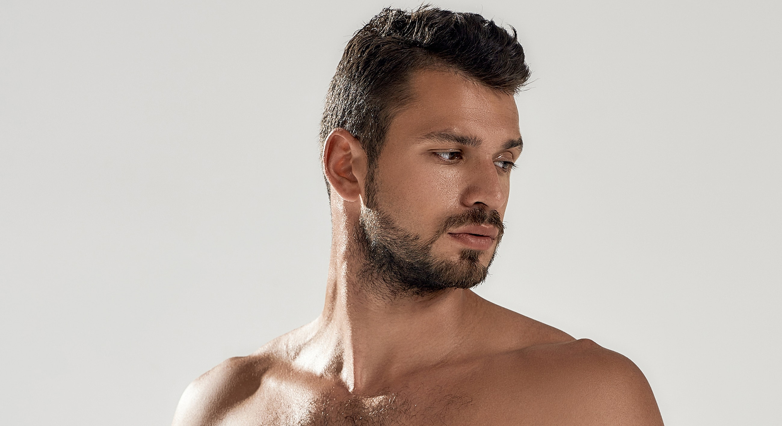 Young man with short hair and beard.
