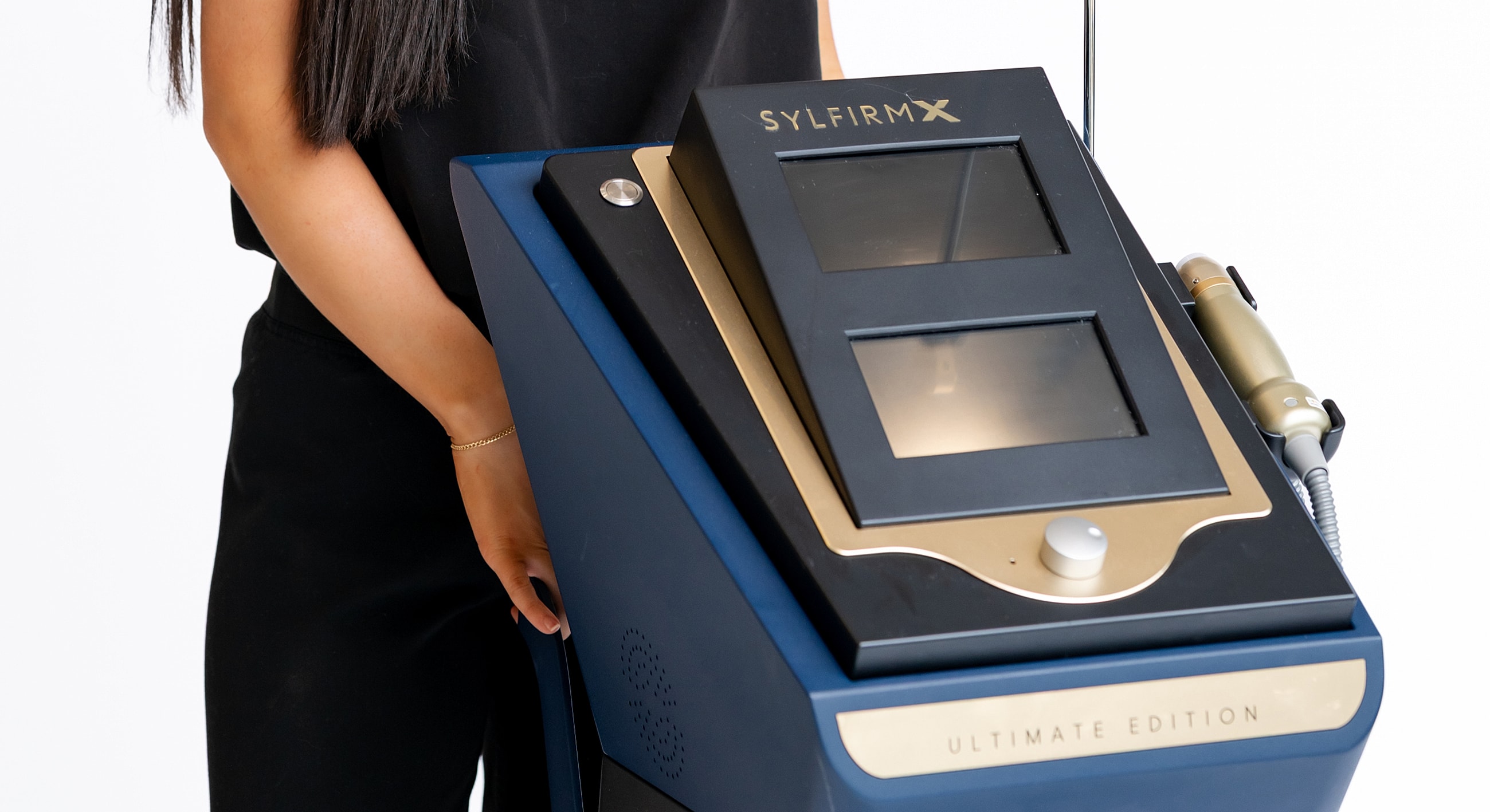 Skin treatment device held by a person.