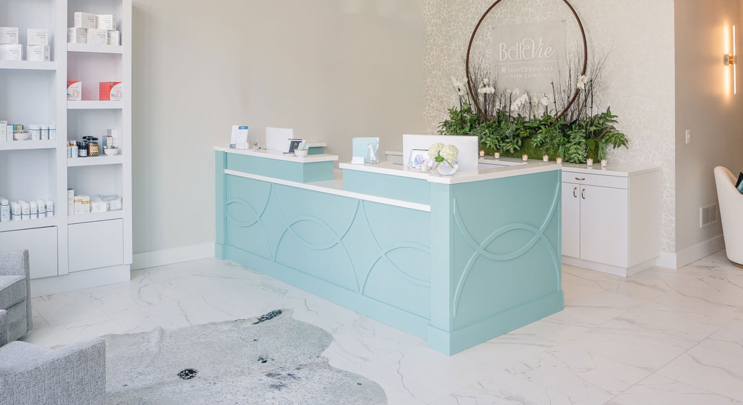 Spa reception area with elegant decor and products.